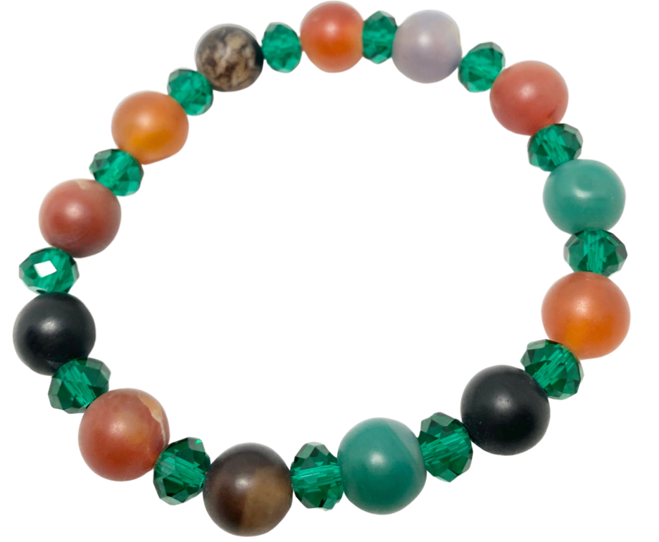 Crafted with agate, cornelian, and onyx, this stretch bracelet offers an elegant mix of brown, green, and black tones. Shop now for this exquisite piece of handmad