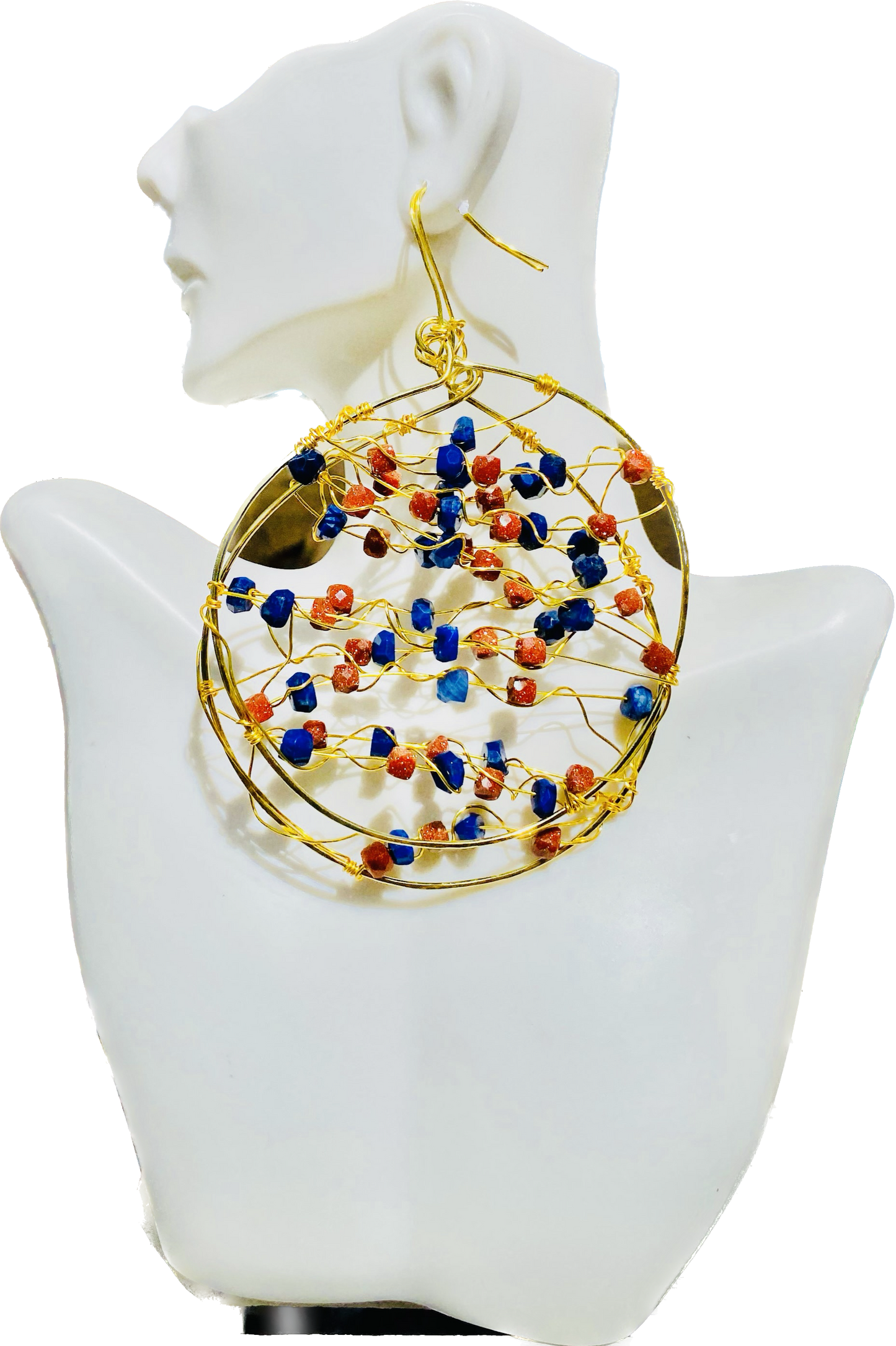 These exclusive hoop earrings feature a unique blend of goldstone and lapis, creating a subtly sparkling, luxe look. Crafted to be hypoallergenic and designed with a