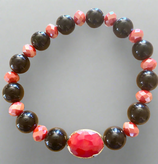  
Sophisticated and stylish, this onyx, crystal, red, and black stretch bracelet is an exquisite piece of handmade jewelry, available with free U.S. shipping on orde